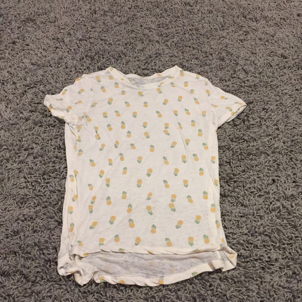 Adorable pineapple see through top.